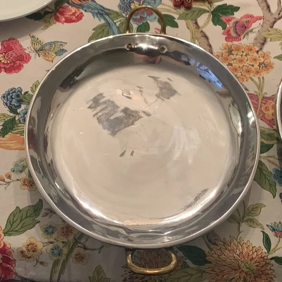 Stainless steel? Brass handle huge trays? Skillets? Made in Mexico